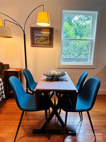a view of a dining room with furniture and window