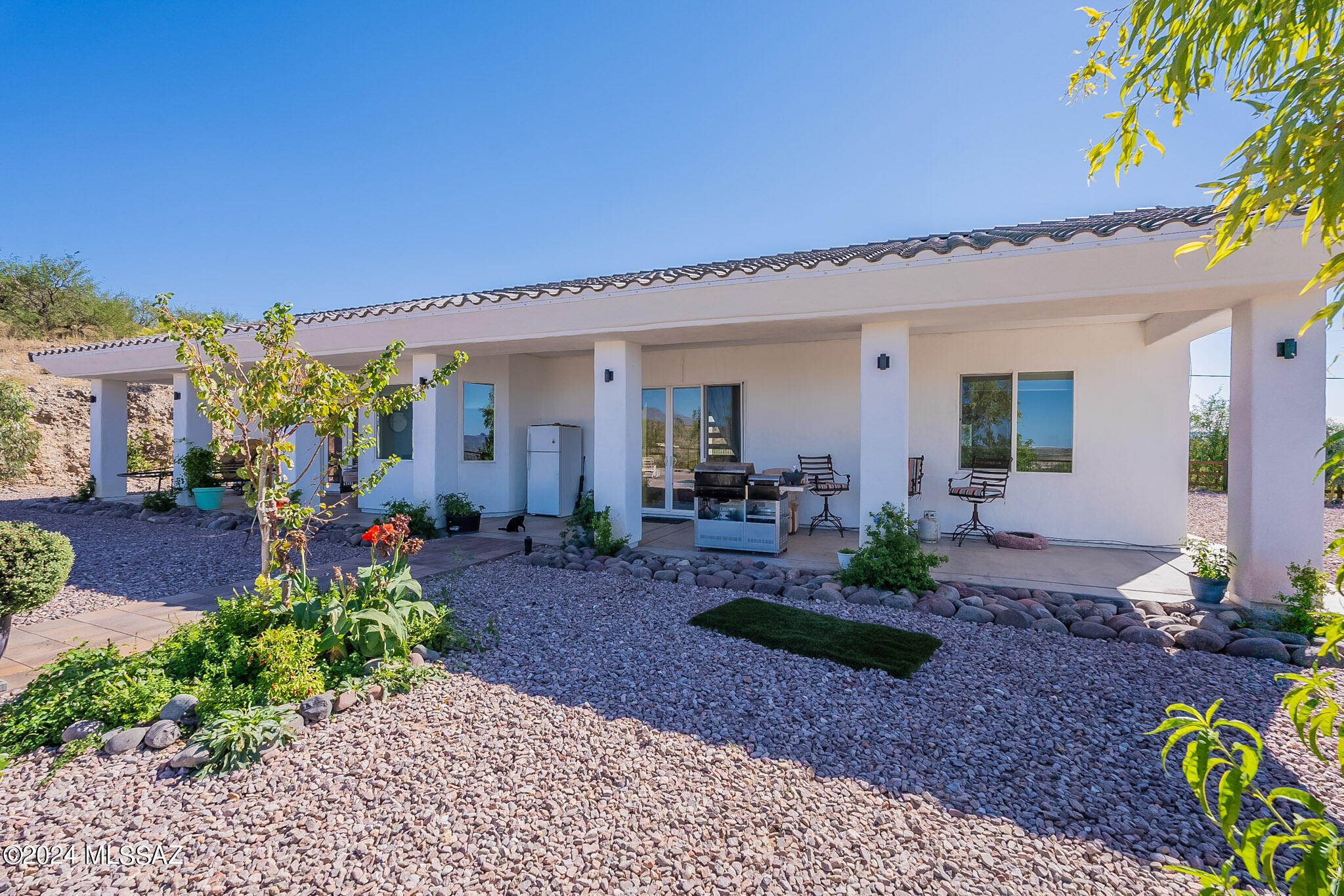 176 Avenida Ostion Rio Rico, AZ 85648 - Photo 42 of 48 a front view of a house with garden