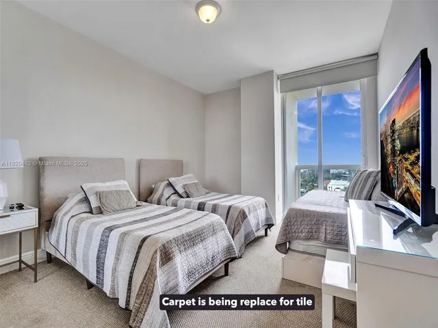 a bathroom with a toilet a sink and shower
