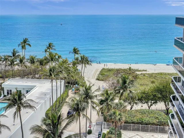 a view of a yard and ocean view