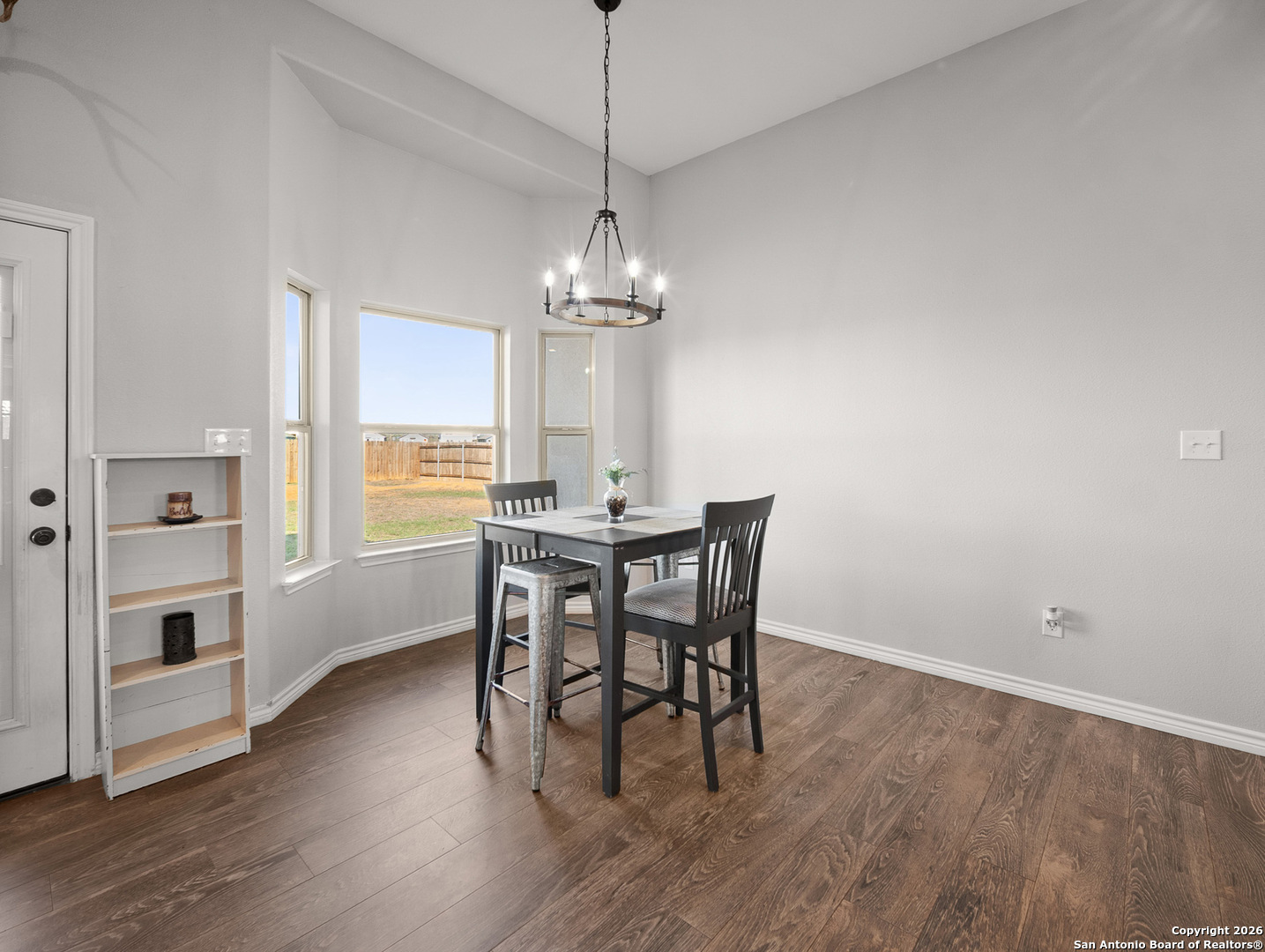 1712 Vista View Drive Pleasanton, TX 78064 - Photo 13 of 37 a view of a dining room with furniture window and wooden floor