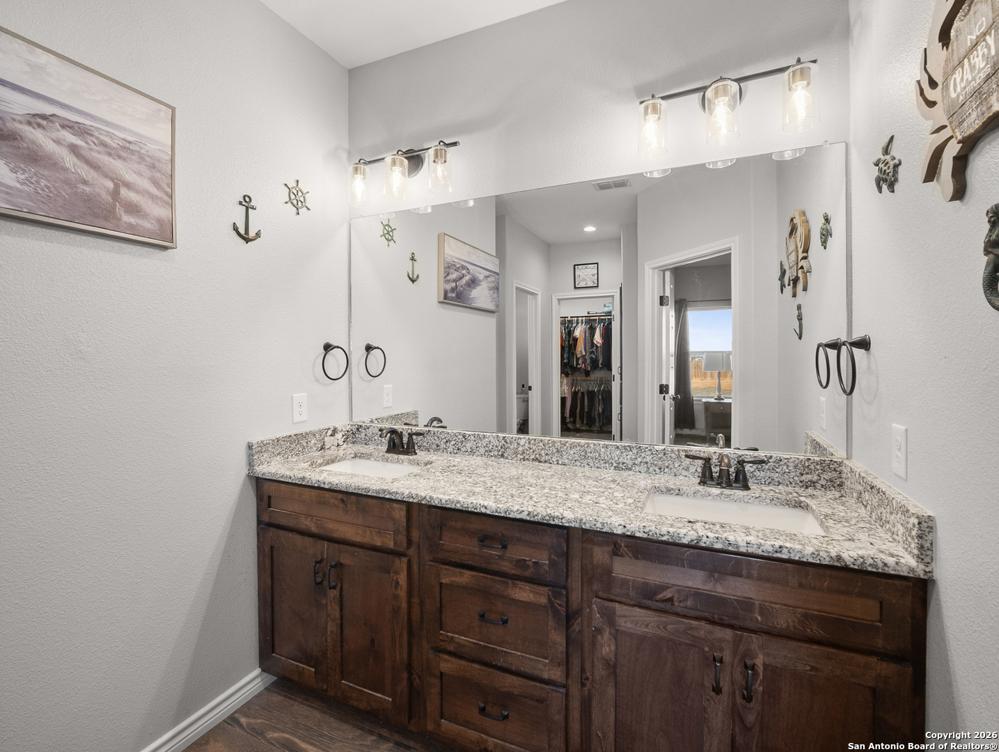 1712 Vista View Drive Pleasanton, TX 78064 - Photo 19 of 37 a bathroom with a granite countertop sink a mirror and shower