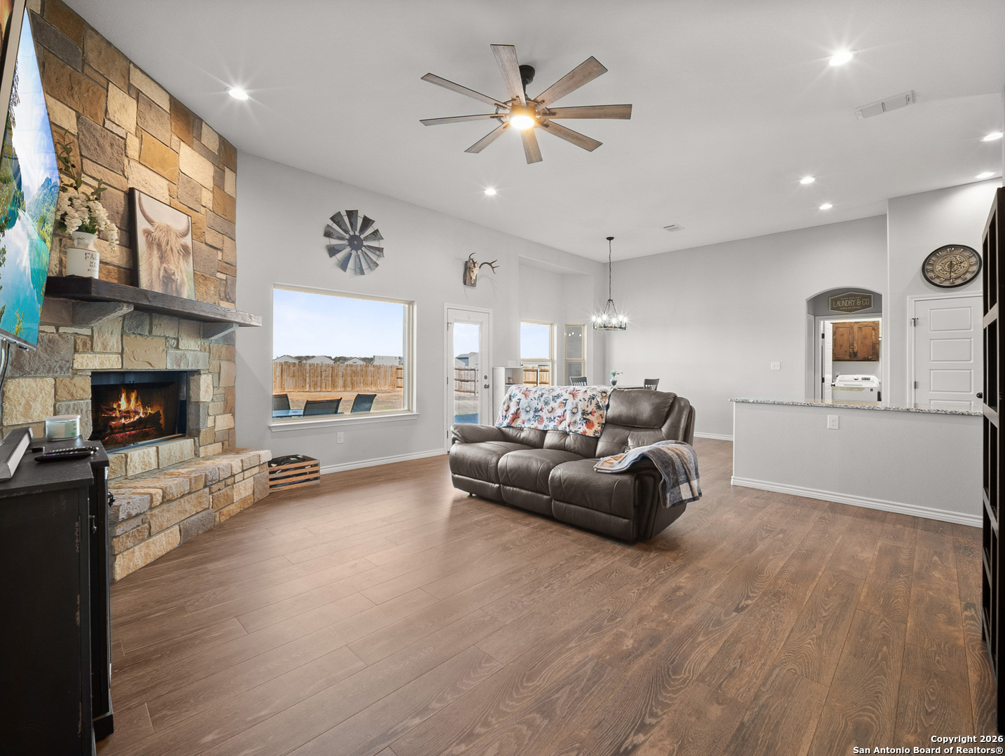 1712 Vista View Drive Pleasanton, TX 78064 - Photo 6 of 37 a living room with furniture and a fireplace