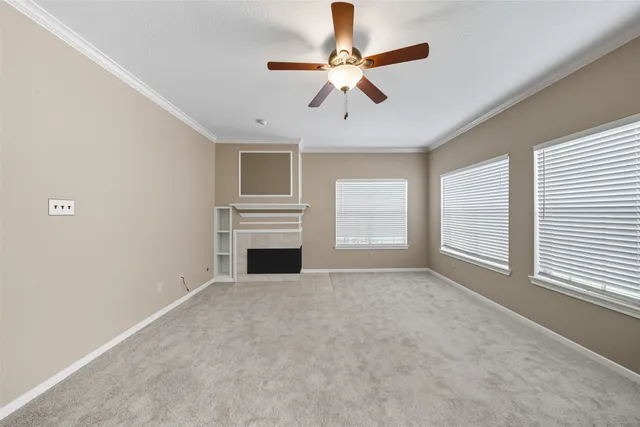 a view of livingroom with a ceiling fan window and a ceiling fan