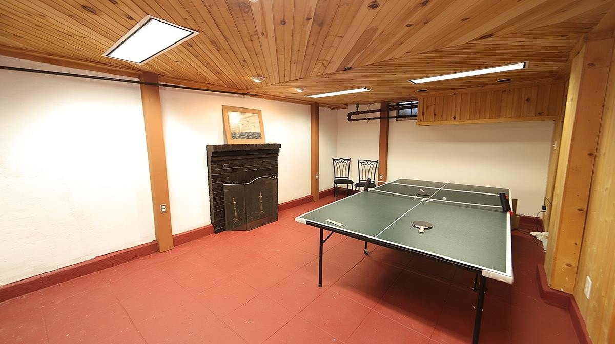1608 Craig Street Raleigh, NC 27608 - Photo 32 of 42 Extra space in the basement that's just right for a game of ping pong or work out room. There is an area already plumbed in for a bath, shower and sink here. The room on the other side has more storage space and the washer/dryer. Basement