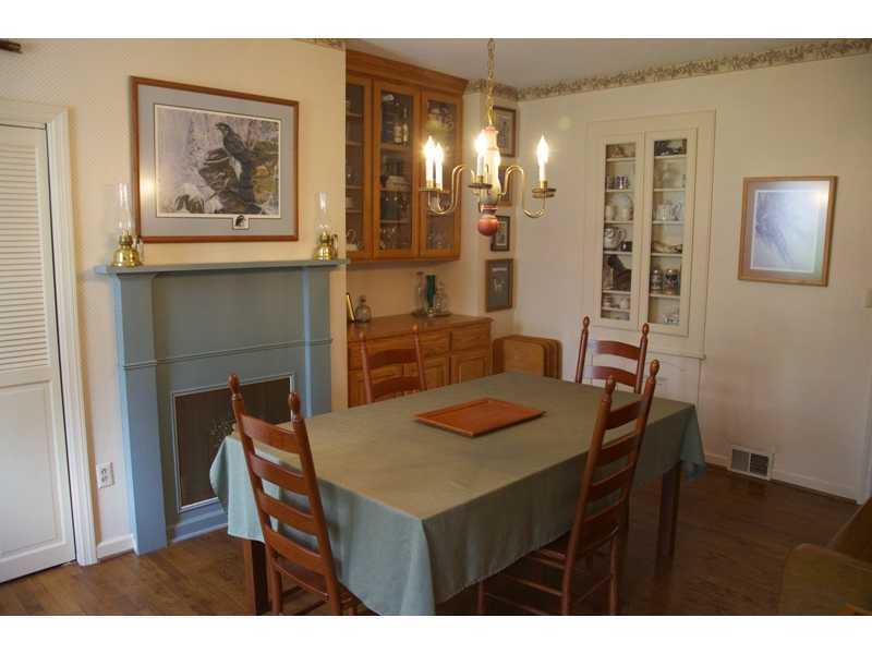 225 Wylie Road Saxonburg, PA 16056 - Photo 16 of 20 Dining Room. Dining Room with Decorative Fireplace and Built-In China Cabinets