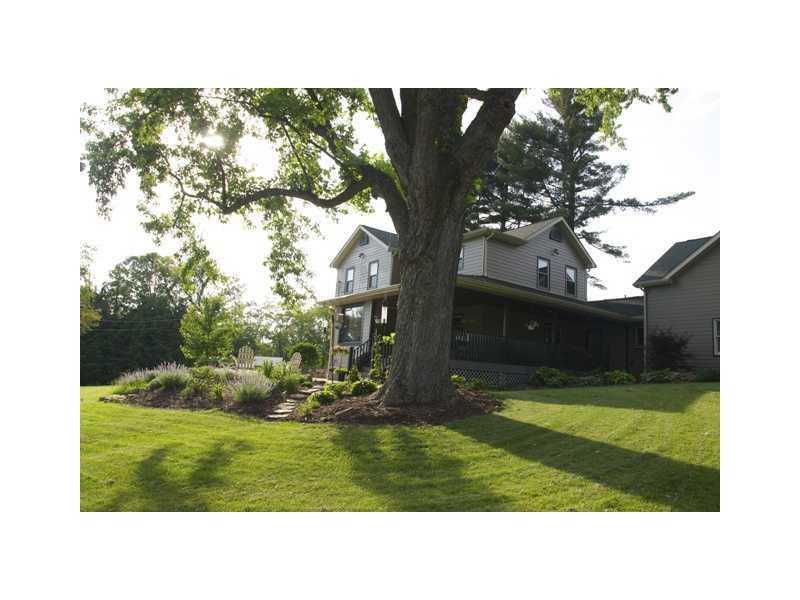 Exterior Back. Wrap Around Porch with Patio View