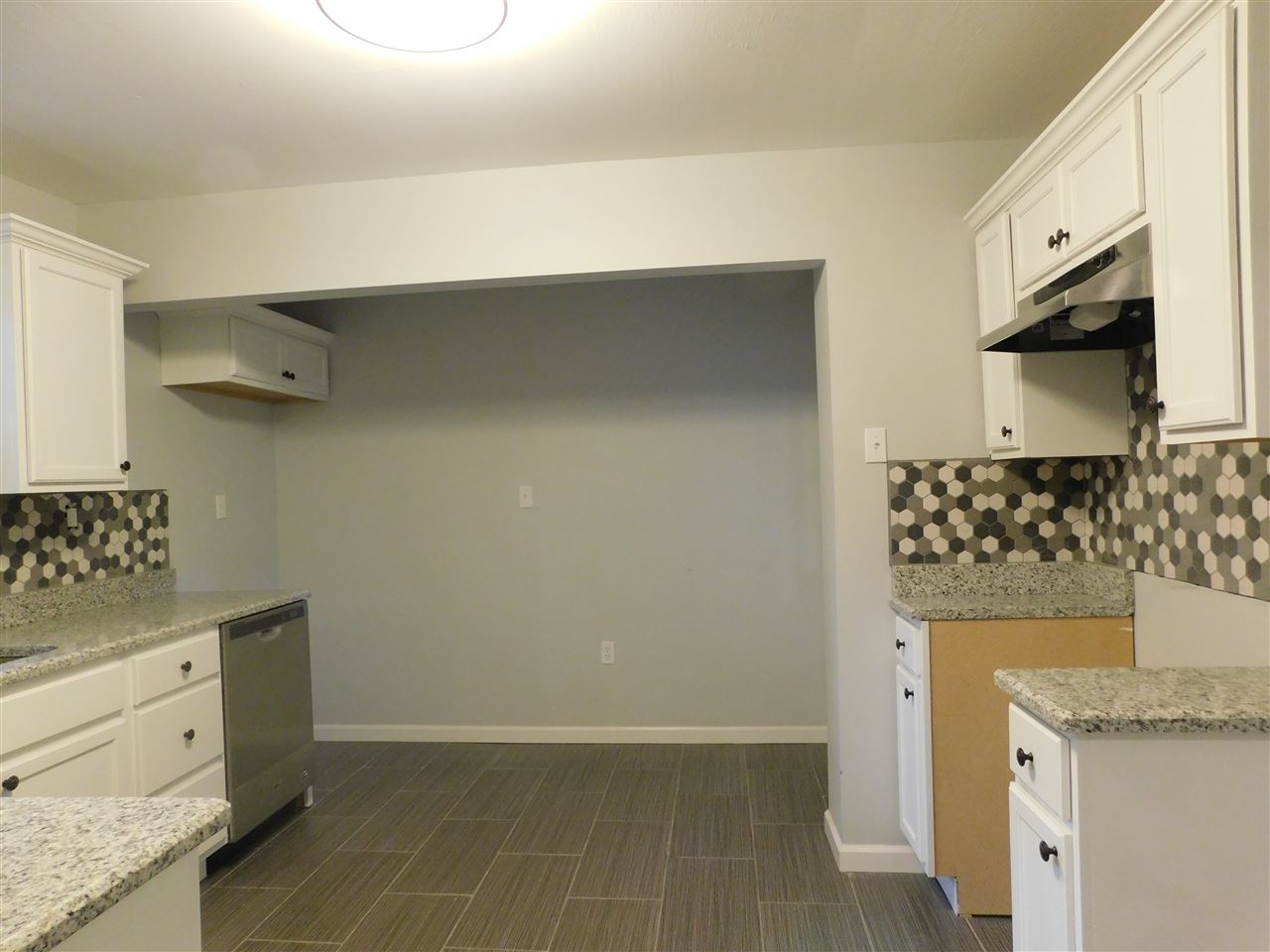 4567 Flamingo Road Memphis, TN 38117 - Photo 9 of 25 Nice open kitchen with lots of cabinet space, granite counter tops, stainless dishwasher and stainless vent hood.