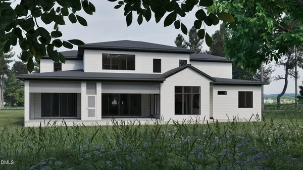 a view of a white house with large windows and a small yard