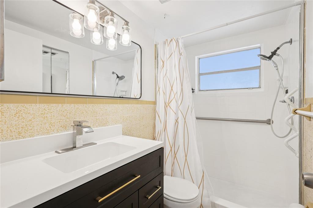 3548 Darlington Road Holiday, FL 34691 - Photo 16 of 32 a bathroom with a sink a toilet and shower