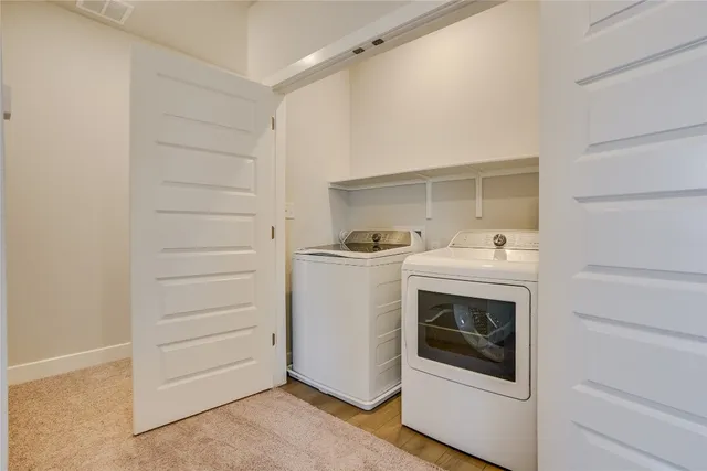 a utility room with washer and dryer