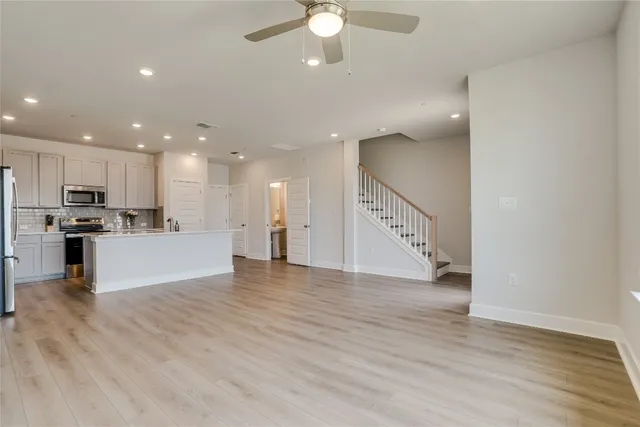 a view of kitchen with cabinets and wooden floor