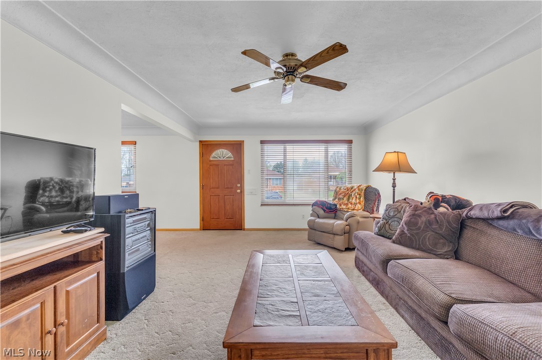 3023 Norris Avenue Cleveland, OH 44134 - Photo 5 of 41 Living area featuring light-colored walls and neutral carpeting