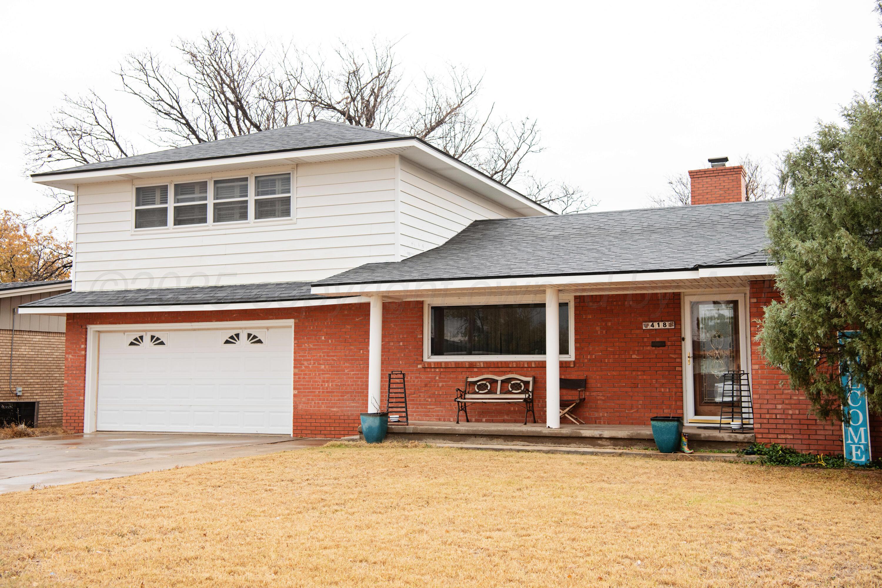 a front view of a house with a garage and a garage