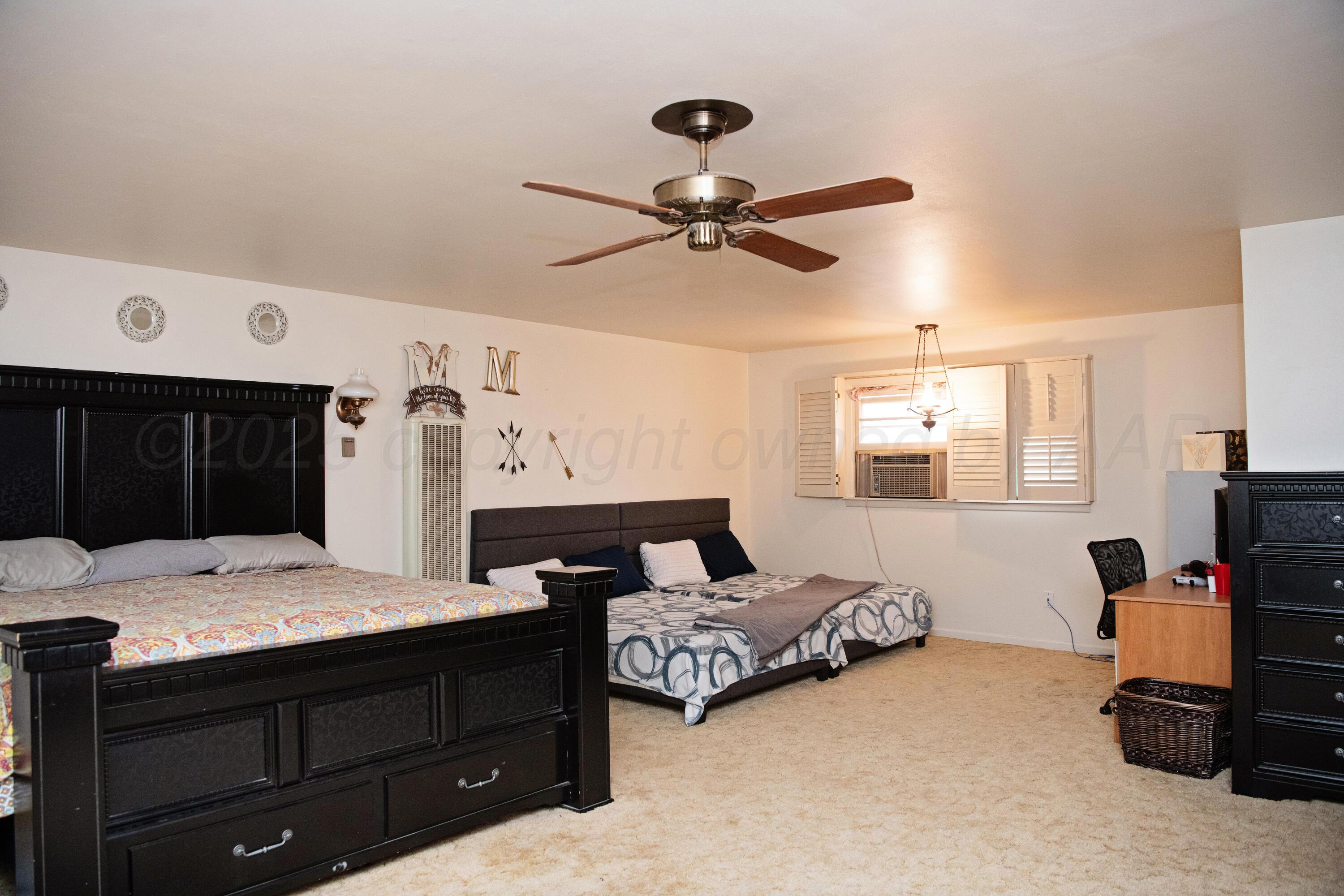 418 Star Street Hereford, TX 79045 - Photo 14 of 17 a bedroom with a bed and a window