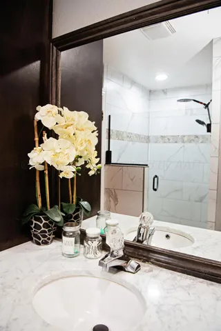 a bathroom with a sink and a mirror