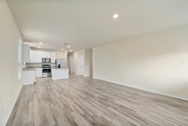 a view of kitchen with wooden floor