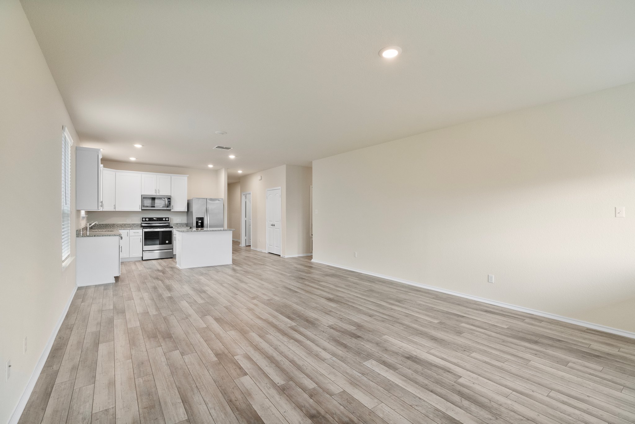 141 Onna Street Taylor, TX 76574 - Photo 14 of 26 a view of kitchen with wooden floor