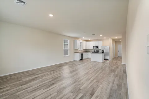 a view of kitchen with wooden floor