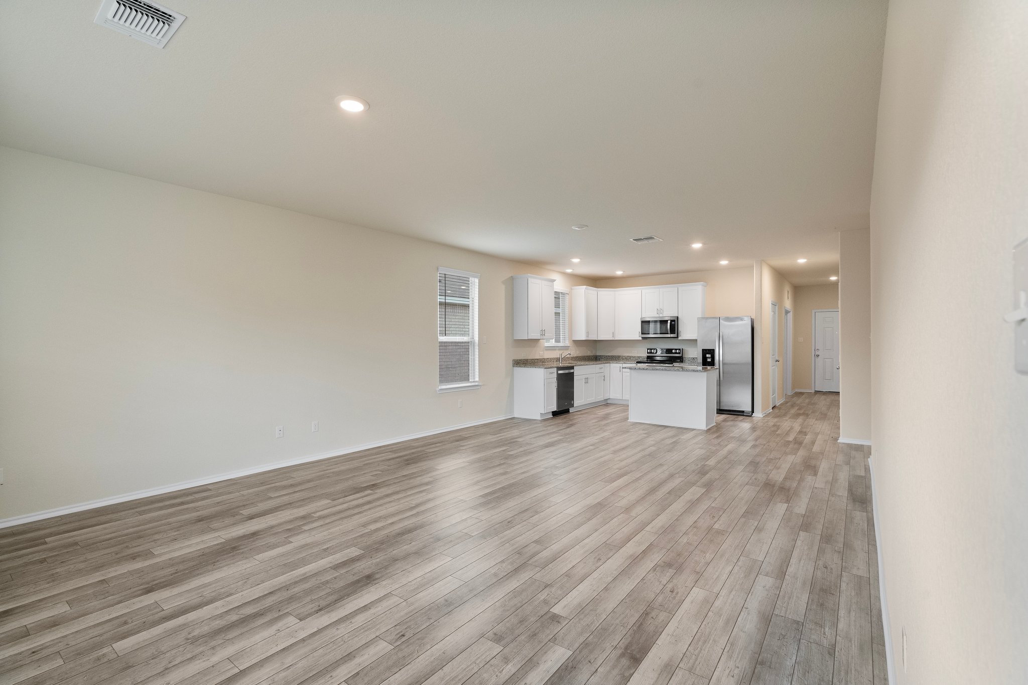 141 Onna Street Taylor, TX 76574 - Photo 15 of 26 a view of kitchen with wooden floor