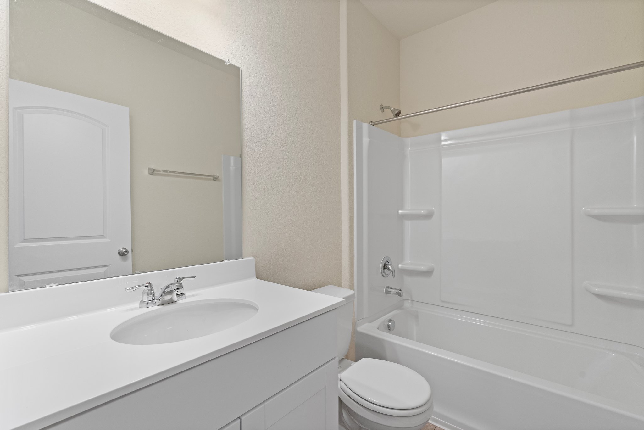 141 Onna Street Taylor, TX 76574 - Photo 22 of 26 a bathroom with a sink toilet and shower