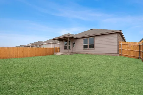 a backyard of a house with lots of green space