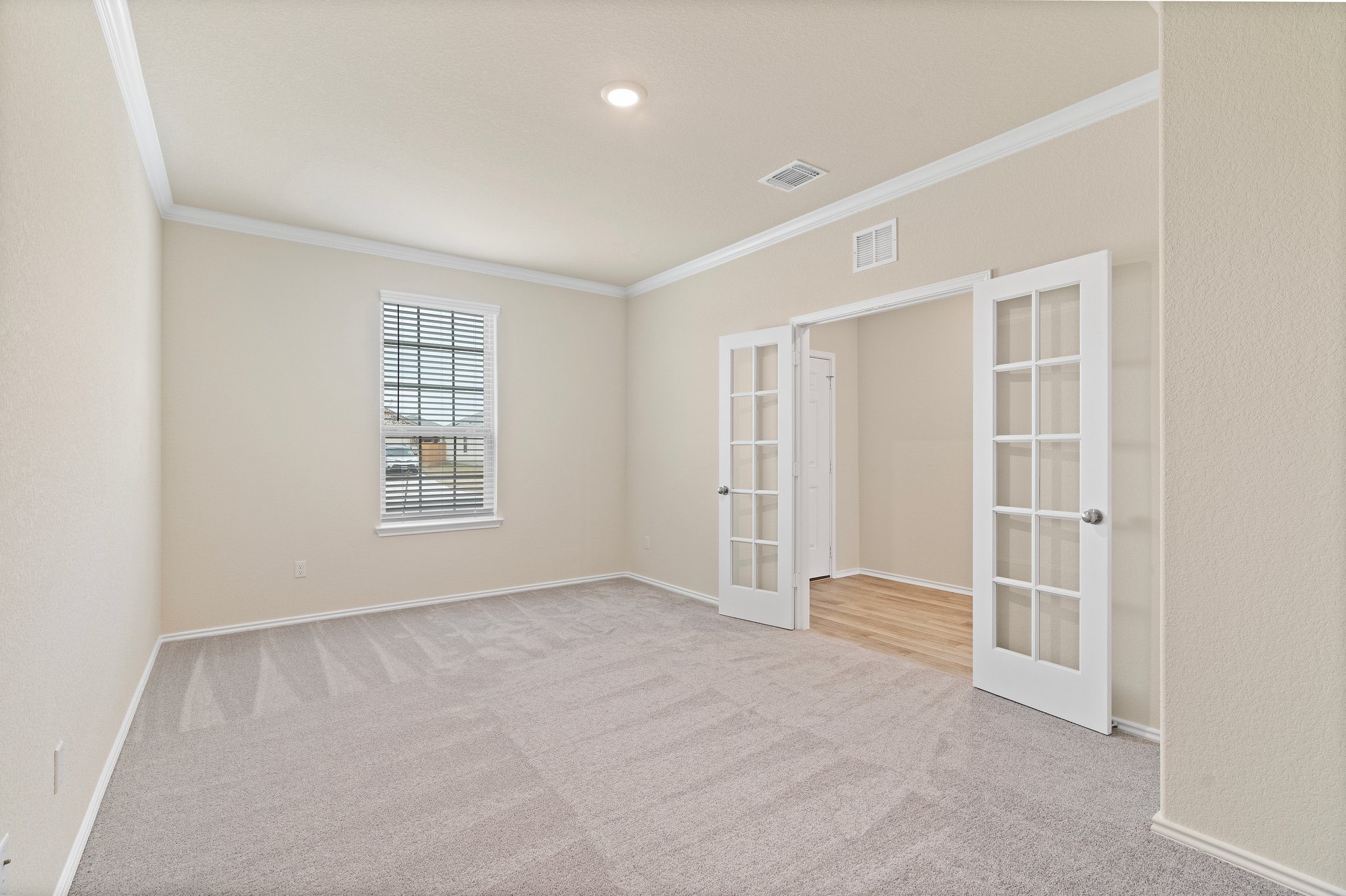 141 Onna Street Taylor, TX 76574 - Photo 3 of 26 an empty room with windows