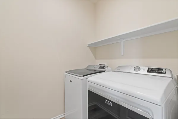 a utility room with dryer and washer