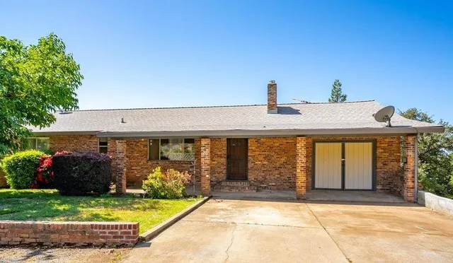 a view of a porch with wooden floor and outdoor space