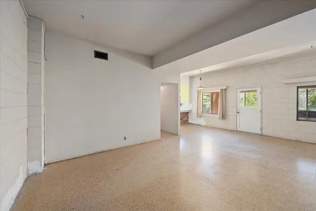 an empty room with windows