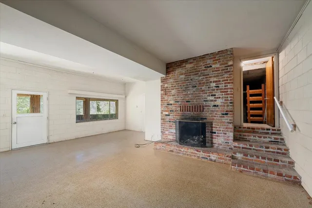 a view of a kitchen with a sink and a large window