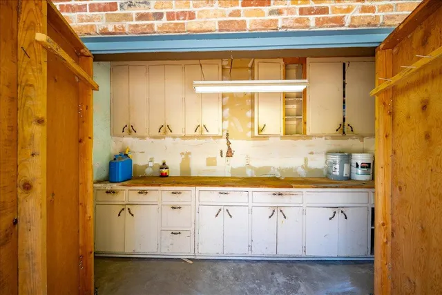 a view of backyard with swimming pool