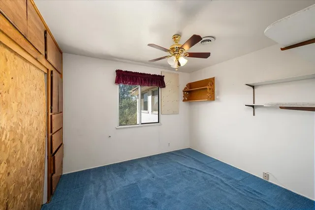 a en suite bathroom with a double vanity sink and a mirror
