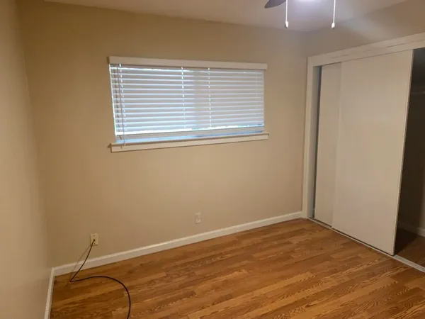 a bathroom with a toilet sink vanity tub and shower