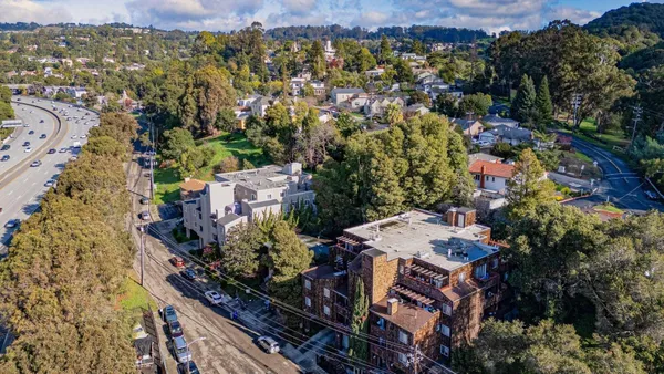 an aerial view of a city with lots of residential buildings