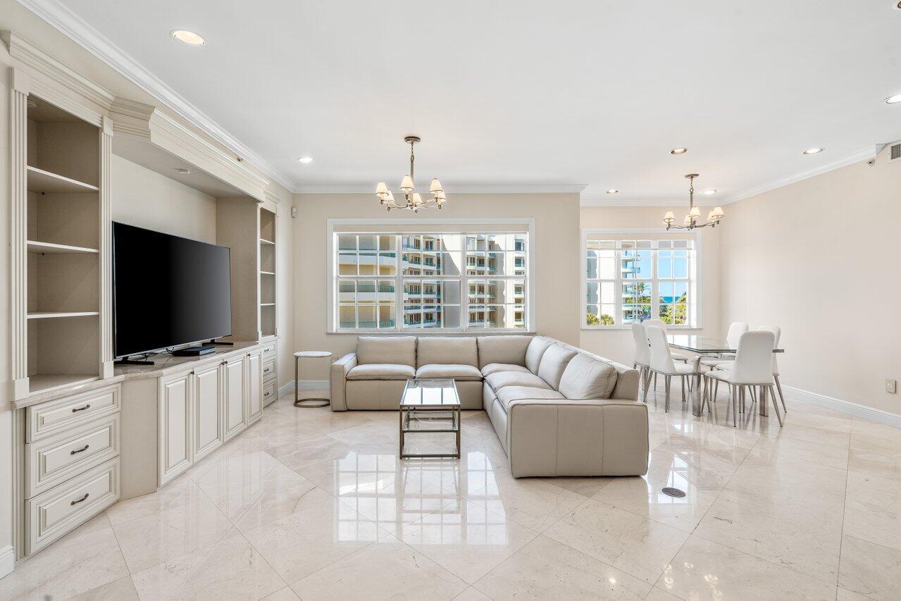 3000 Florida A1A, Unit 302 Daytona Beach, FL 32118 - Photo 15 of 48 a living room with furniture and a flat screen tv