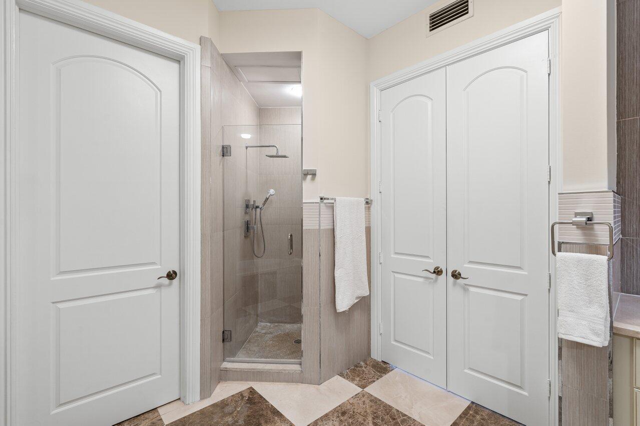 3000 Florida A1A, Unit 302 Daytona Beach, FL 32118 - Photo 20 of 48 a bathroom with a shower