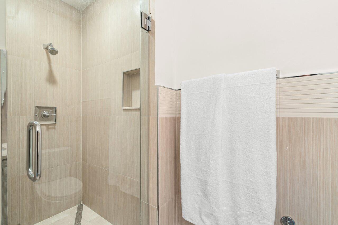3000 Florida A1A, Unit 302 Daytona Beach, FL 32118 - Photo 32 of 48 a bathroom with a shower