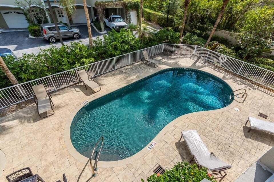 3000 Florida A1A, Unit 302 Daytona Beach, FL 32118 - Photo 36 of 48 a view of a swimming pool with a patio