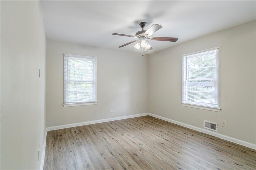 6281 Denny Lane Southwest Mableton, GA 30126 - Photo 16 of 27 a view of an empty room with wooden floor and a window