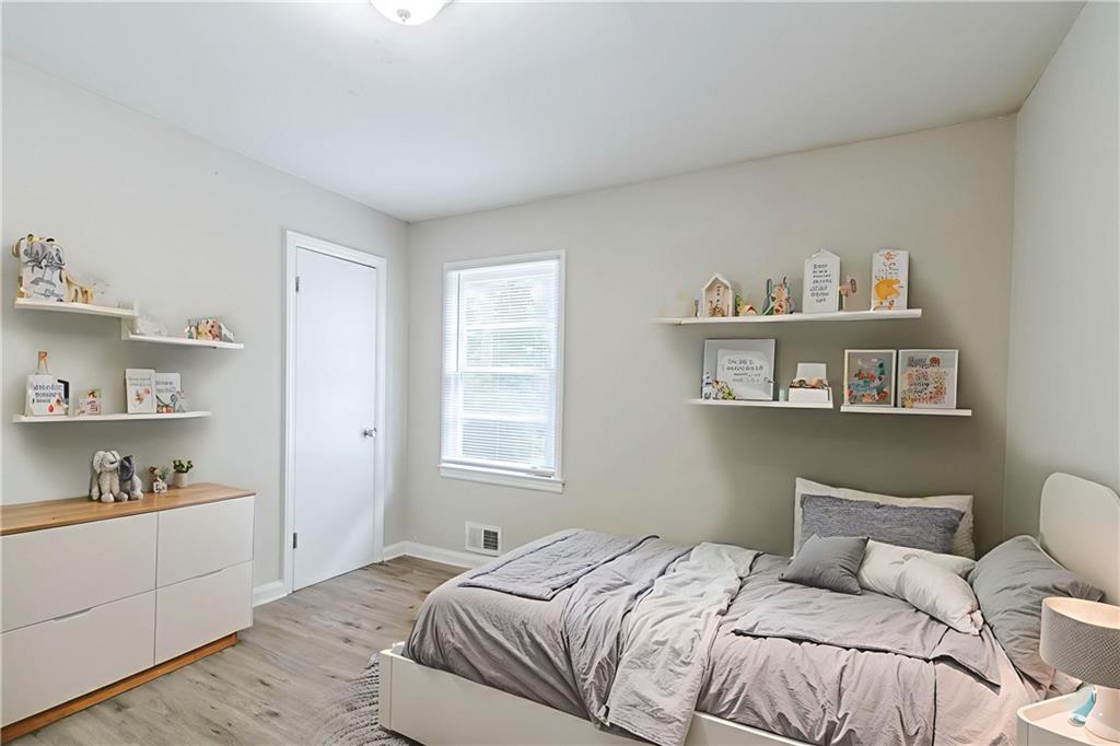 6281 Denny Lane Southwest Mableton, GA 30126 - Photo 19 of 27 a bedroom with a bed and a window