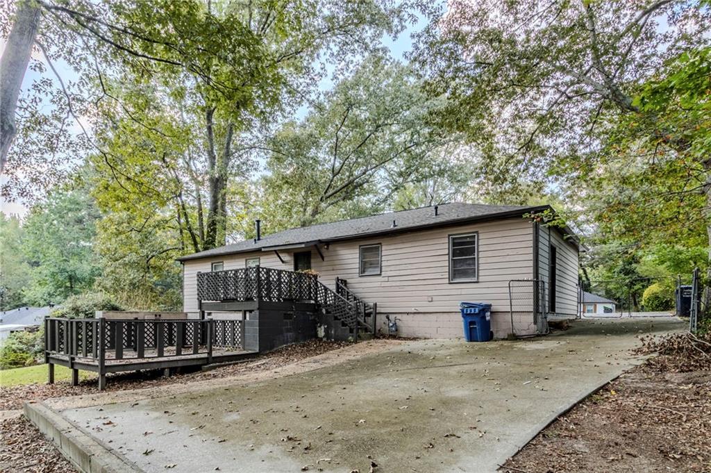 6281 Denny Lane Southwest Mableton, GA 30126 - Photo 24 of 27 a view of a house with a patio and wooden deck