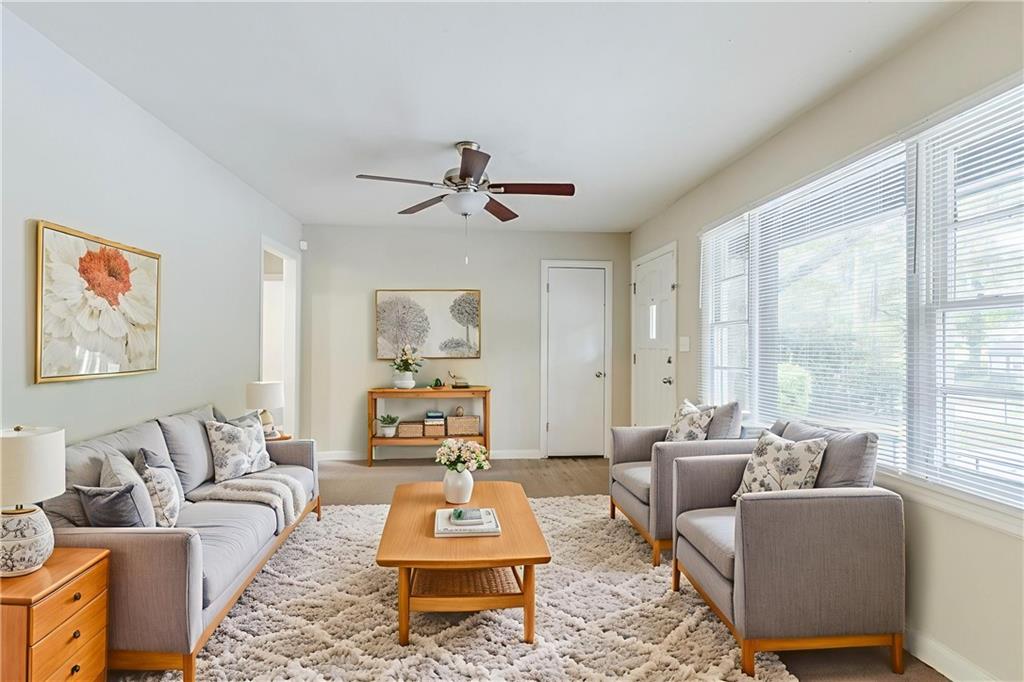 6281 Denny Lane Southwest Mableton, GA 30126 - Photo 4 of 27 a living room with furniture a rug and a large window