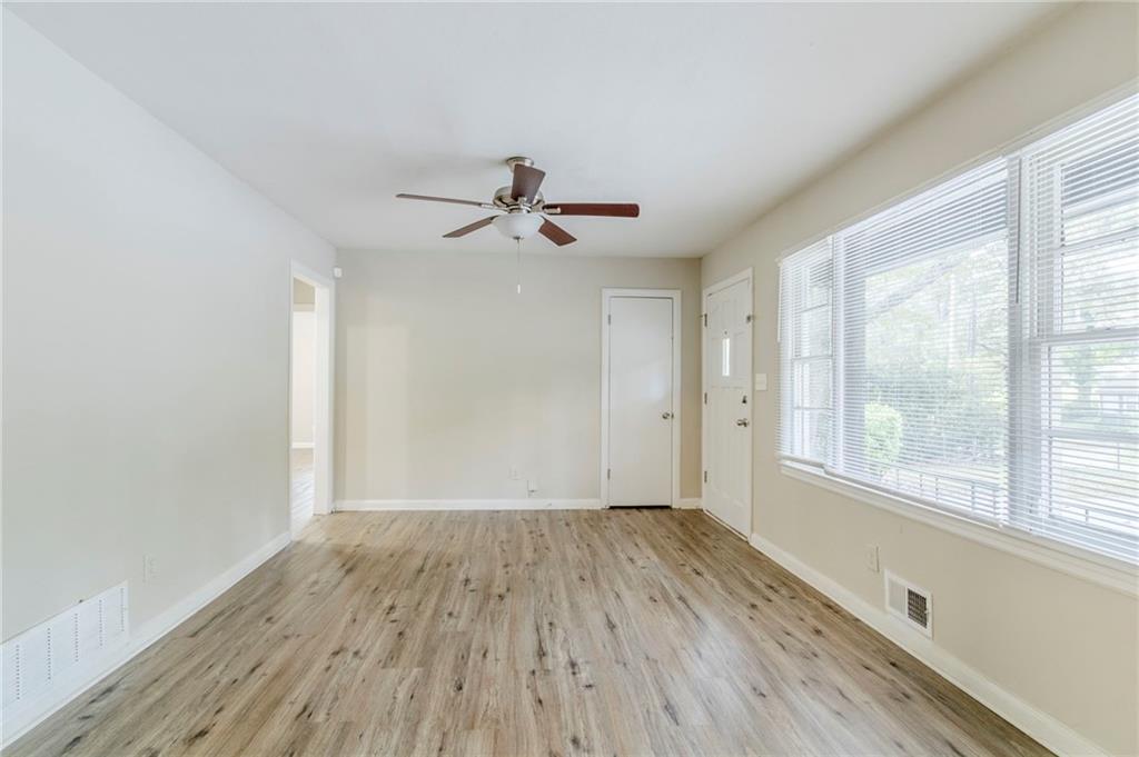 6281 Denny Lane Southwest Mableton, GA 30126 - Photo 5 of 27 a view of room with window ceiling fan and hardwood floor