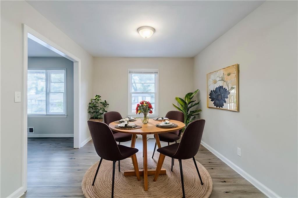6281 Denny Lane Southwest Mableton, GA 30126 - Photo 6 of 27 a view of a dining room with furniture and wooden floor