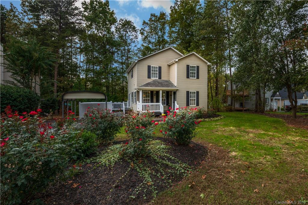 7734 Red Robin Trail Denver, NC 28037 - Photo 1 of 15 a front view of a house with garden