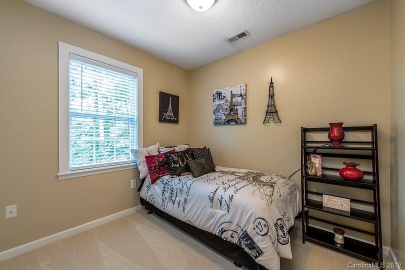 7734 Red Robin Trail Denver, NC 28037 - Photo 13 of 15 a bedroom with a bed and a window