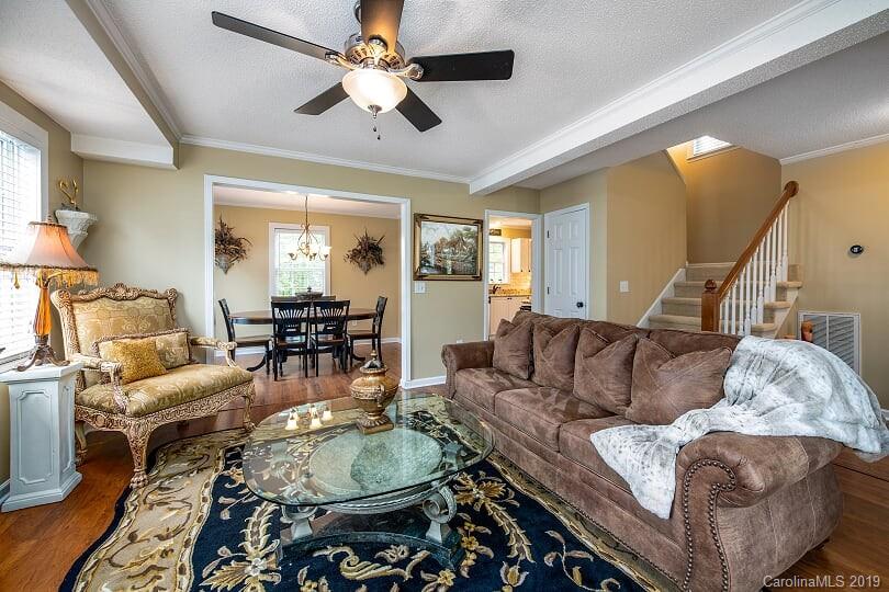 7734 Red Robin Trail Denver, NC 28037 - Photo 3 of 15 a living room with furniture and a chandelier