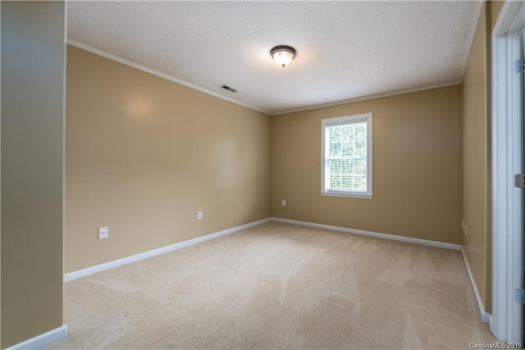 7734 Red Robin Trail Denver, NC 28037 - Photo 9 of 15 a view of an empty room with a window