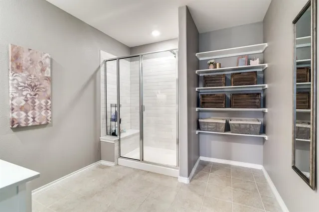 a view of an empty room with a kitchen